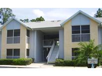 Charming condo building exterior featuring well-maintained landscaping and inviting entrances at 101 Bent Tree Dr # 12, Daytona Beach, FL 32114