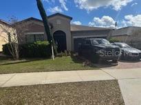 Charming single-story home featuring a well-maintained lawn and a welcoming front entrance at 9362 Oglethorpe Dr, Groveland, FL 34736