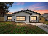 Charming single-story home featuring fresh exterior paint and a well-manicured front yard with new landscaping at 2015 Poe St, Lakeland, FL 33801