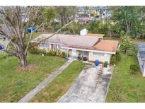 Charming single-story home with mature trees and a spacious front yard at 220 Hillside Dr, Lakeland, FL 33803
