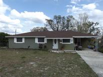 Charming one-story home with a covered carport and a well-maintained lawn in a desirable neighborhood at 4801 Avon St, Lake Wales, FL 33859
