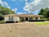 Charming single story home with well-maintained landscaping and a welcoming front porch at 5261 Waterwood Dr, Bartow, FL 33830