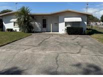 Charming single-story home with a well-maintained lawn, mature landscaping, and a long driveway at 102 Center Sw St, Winter Haven, FL 33880