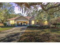 Charming single-story home with a well-manicured front yard and covered parking at 7641 Sw 185Th Cir, Dunnellon, FL 34432