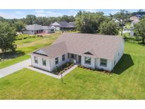 Charming home featuring a well-manicured lawn and landscaped walkway at 2569 Rogers Rd, Lakeland, FL 33812