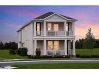 Charming two-story home with double porch, landscaped yard and neutral paint at 16198 Honey Harvest St, Winter Garden, FL 34787