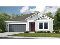 Charming single-story home featuring a two-car garage, well-maintained lawn and Craftsman-style architectural details at 5260 Stone Ridge Pl, St Cloud, FL 34771