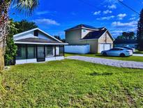 Charming homes featuring well-maintained lawn, white fences, and ample parking at 515 9Th St, Winter Garden, FL 34787