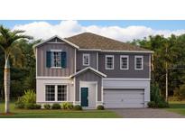 Charming two-story home with well-manicured landscaping and a two-car garage at 759 Terrapin Dr, Debary, FL 32713