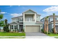 Two-story home with a two-car garage, well-maintained lawn, and a charming covered front porch at 5224 Stone Ridge Pl, St Cloud, FL 34771