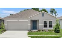 Charming single-story home with a two-car garage, landscaped yard, and covered entry at 1931 Rosewood Cir, Lakeland, FL 33810