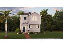 Charming two-story home with a well-manicured lawn and beautiful landscaping at 1832 Bright Sky Dr, Kissimmee, FL 34744
