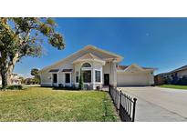Charming single-story home with well-manicured lawn and inviting curb appeal at 512 Lost Creek Ct, Kissimmee, FL 34743