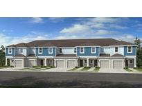 New construction townhomes showcasing a traditional two-story style with attached garages at 161 River Front Way, Edgewater, FL 32141