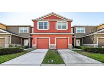 Charming multi-Gathering home featuring two-story design, private driveways, and welcoming curb appeal at 2938 Rodrick Cir, Orlando, FL 32824