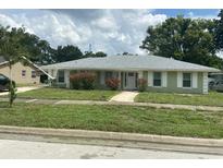 Charming single-story home featuring a well-manicured lawn and inviting front entrance at 2502 Vine St, Orlando, FL 32806