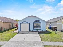 Charming single-story home featuring a well-maintained lawn and inviting curb appeal at 2506 Hadleigh St, Kissimmee, FL 34743