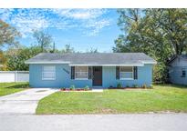 Charming single-story home featuring a well-manicured lawn and a freshly painted exterior at 1126 Waterview E Blvd, Lakeland, FL 33801