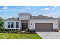 Charming single-story home featuring a well-manicured lawn and a welcoming two-car garage at 5646 Nevis Ter, Kissimmee, FL 34758