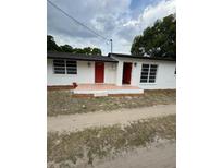 Charming single-story home featuring a fresh exterior paint, red door, and well-maintained front yard at 1460 Marvin C Zanders Ave, Apopka, FL 32703