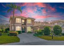 Beautiful two-story home with a well-manicured lawn, lush landscaping, and a grand entryway at 1229 Sebastian Cv, Lake Mary, FL 32746