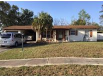 Charming single-story home features a well-kept lawn and mature landscaping at 894 Superior St, Deltona, FL 32725