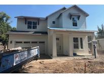Two-story home features a symmetrical facade, large windows and a neutral color palette at 3611 Chelsea St, Orlando, FL 32803