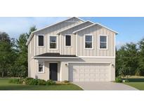 Charming two-story home featuring a crisp white exterior, black shutters, and an attached two-car garage at 1807 Teagan Ln, Winter Haven, FL 33884