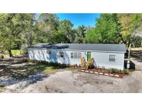 Charming single-story home featuring a well-maintained lawn and freshly painted siding at 4609 Creek Meadow Trl, Lakeland, FL 33810