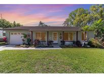 Charming single story home featuring well-maintained landscaping and a cozy front porch at 820 Rio Ala Mano Dr, Altamonte Springs, FL 32714