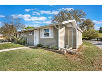 Charming one-story home with siding, well-maintained landscaping, and inviting curb appeal at 10301 Us Highway 27 # 26, Clermont, FL 34711