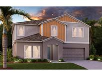 Charming two-story home with a two-car garage and a well-manicured lawn at twilight at 1018 Foreshore Ln, Haines City, FL 33844