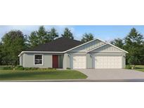 Charming single-story home with a two-car garage, featuring a modern facade and well-maintained lawn at 1261 Deepwater Cir, Eagle Lake, FL 33839