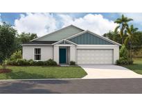 Charming single-story home with manicured lawn, attached two-car garage, and modern architectural details at 1570 Sage Ave, Haines City, FL 33844