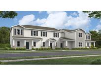 Charming townhome showcasing a neutral palette, multiple windows and inviting front entrances at 2276 Red Sun St, Apopka, FL 32703