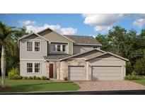 Two-story home with a blend of stone and siding and a two-car garage complemented by a well-manicured lawn at 254 Puma Loop, Groveland, FL 34736