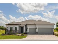 Beautiful single-Gathering home with a three-car garage and manicured landscaping at 8980 Sw 52Nd Place Rd, Ocala, FL 34481