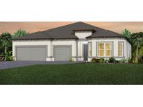 Beautiful single-story home showcasing a three-car garage and neutral color palette at 9245 Sw 52Nd Place Rd, Ocala, FL 34481