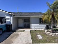 Charming single-story home with a front yard, featuring a freshly-painted facade and a well-maintained walkway at 5835 Talavera St, Orlando, FL 32807