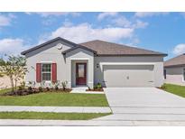 Charming single-Gathering home with a well-manicured lawn and inviting front entrance at 1645 Nantucket Way, Winter Haven, FL 33884