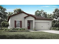 Charming single-story home with manicured lawn, two-car garage, and welcoming front door at 1802 White Elephant Loop, Winter Haven, FL 33884