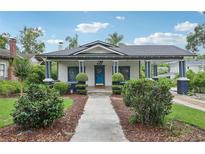Charming single-Gathering home with a covered porch and meticulous landscaping at 515 Frank Lloyd Wright Way, Lakeland, FL 33803