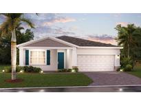 Charming single-story home with a well-manicured lawn, blue shutters, and a two-car garage at 2539 Peace Of Mind Dr, Kissimmee, FL 34744