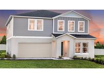 Two-story home featuring a gray exterior, attached two-car garage, and well-maintained front lawn at 2212 Canyon Oak Dr, Davenport, FL 33837
