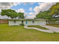 Charming single-story home with a well-maintained lawn and inviting walkway at 9210 Lehall W Sq, Lakeland, FL 33810