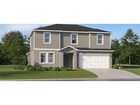 Two-story home with gray siding, white trim, front yard landscaping, and attached two car garage at 4200 Singing Mockingbird Blvd, Bartow, FL 33830