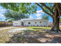 Charming home with fresh exterior paint, updated windows, and newly landscaped front yard at 1037 Waynesville Ave, Lakeland, FL 33801
