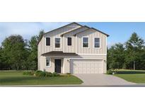 Charming two-story home with a two-car garage, nicely landscaped yard and board and batten accents at 1373 Acorn Meadow Loop, Eustis, FL 32726