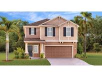 Charming two-story home with landscaped front yard, garage, and inviting entrance in a desirable neighborhood at 5686 Portico Pl, Kissimmee, FL 34758