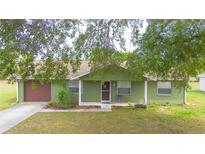 Charming single-story home with a well-manicured front yard and a welcoming entrance at 14791 Sw 29Th Avenue Rd, Ocala, FL 34473